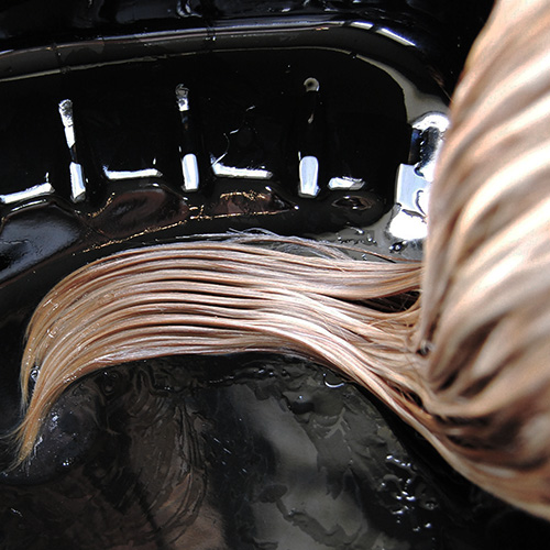 Blonde hair processing at wash bowl